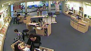 Surveillance video shows men steal eyeglass frames