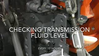 How do I check the transmission fluid level on a Kubota MU4501 tractor?