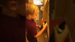 Sam fixing his hair 4/12/15- age 5