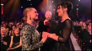 Petra Mede kisses Malin Levanon on Swedish Awards night Guldbaggegalan