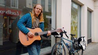 Riki A man with a guitar on a bike | Ashford town | Mark IV 425 | British tank