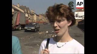 NORTHERN IRELAND: ARDOYNE: RESIDENTS CLEAN UP AFTER RIOTING