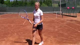 Linda Dubska, service training, at clay court of the Guillermo Vilas tennis academy