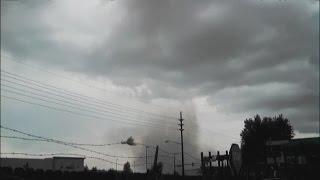 Workers take cover as tornado forms overhead