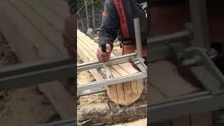 Cutting lumber with a chainsaw mills