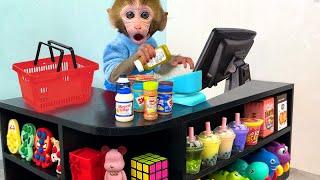 Monkey Baby Bon Bon pretend to be a cashier in a supermarket and eats watermelon with puppy