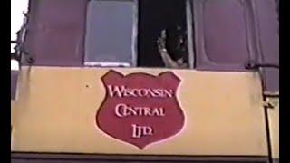 Wisconsin Central in Des Plaines. 1989-early '90s. Semaphore at Deval. Algonquin Rd. Rand Rd. SP MTs