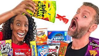 Brits Try American SNACKS and CANDY For The FIRST TIME!