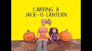 Barbie & Chelsea carve a pumpkin into a Jack-O-Lantern. They even light it and turn off the lights!