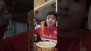 tasting hot spicy chicken ramen noodles