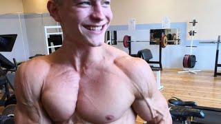 17 years old teen boy flexing muscle