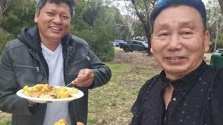 We are gurung families having a picnic in Tasmania Australia