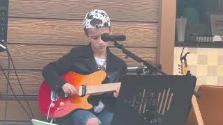 9-year-old Jovi at an open mic night playing Thunderstruck by AC/DC