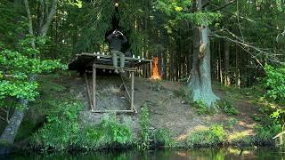 Building a bushcraft camp on a slope near a river. Cooking in nature!