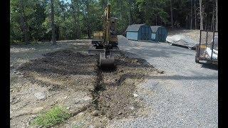 Digging a drainage trench