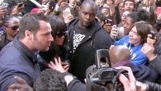 REALLY CRAZY - RIHANNA almost crushed by a sea of fans while entering her hotel in Paris !!!