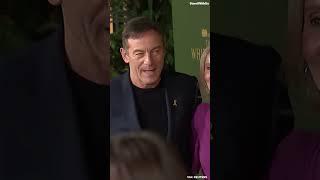 Jason Isaacs showed solidarity and raised awareness with the yellow hostage pin at movie premiere