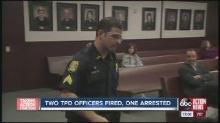 Two TPD officers fired, one arrested