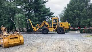 Maintenance of Way Convoy: Pettibone Speed Swing and Hi-Railers on Tracks. Freight Rail Rehab