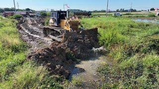 Bulldozer Dozer Komat’su D53E Pushing Soil Delete Forest Into Water