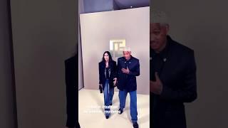 Cher with boyfriend Alexander Edwards at the Balmain show in Paris, France. #cher