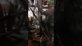 Making a spinning chain connection on an oil drilling rig Alberta Canada