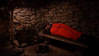 A man is restoring a stone house in the mountains. Spends the night alone. Without words.