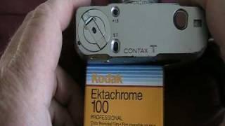 Contax T 35mm pocket camera beside a current digital camera