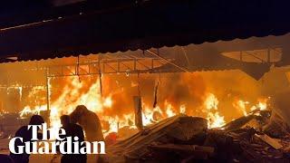 Gaza: tents engulfed by flames after Israeli airstrike next to al-Aqsa hospital