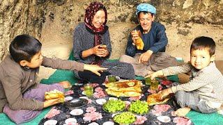 Young Mother Living and cooking traditional style in Cave like 2000 years ago.