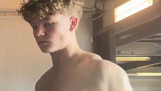 16 years old teen boy flexing muscles