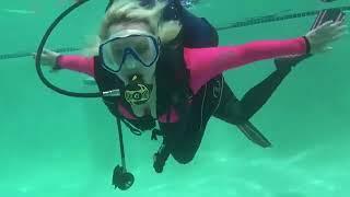 scuba diving girl in the pool.