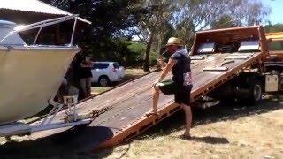 Loading boat onto tow truck