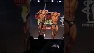 Two bodybuilders in a flex off